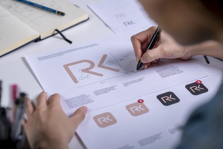 Logo design sketches on paper